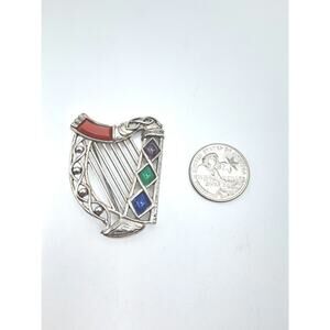 54.  Vintage Sol Dior harp brooch